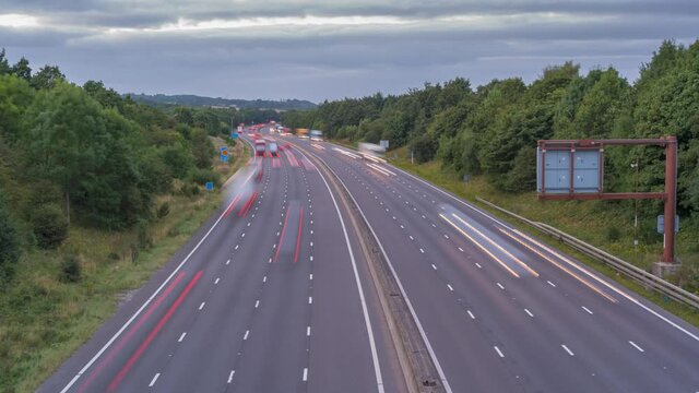 Time lapse of trail lights and traffic near junction 28 on the M1 at dusk, Derbyshire