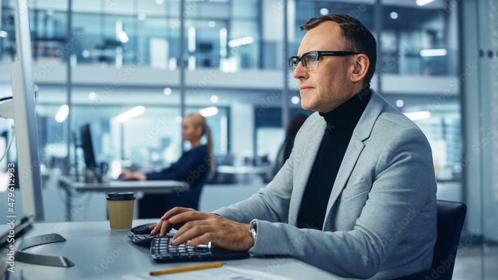 Poster diverse corporate office: stylish handsome big data engineer using desktop computer, screen showing 