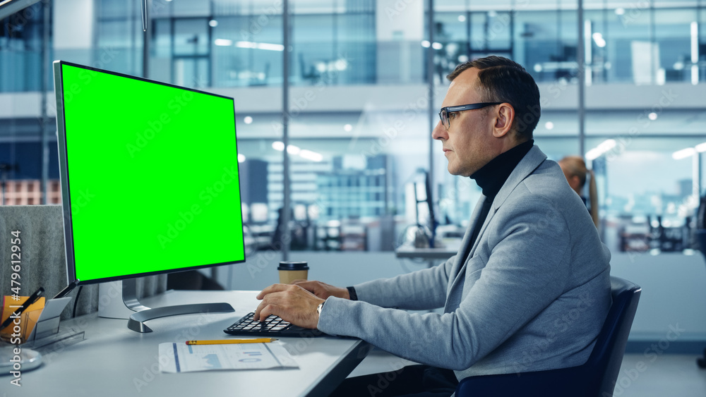 Poster diverse corporate office: stylish handsome big data engineer using desktop computer with green chrom