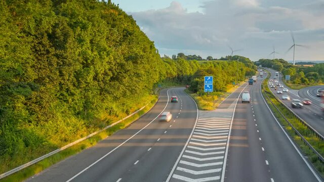 Time lapse of traffic on junction of M18 and M1 and wind turbines in South Yorkshire