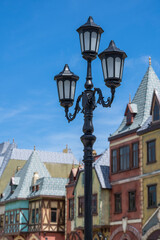 Fototapeta na wymiar Classic victorian street lamps on an old fashioned iron lamp post set, close up