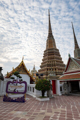 Fototapeta premium Wat Pho, also spelled Wat Po, a famous Buddhist temple complex in Bangkok, Thailand. Popular for tourists and it is also known as Temple of the Reclining Buddha. 