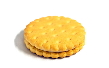 Sandwich cookies with creamy filling on a white background. Confectionery.