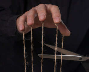 Manipulation concept. Get rid of abuse and authority, cutting strings.