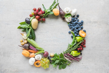 Healthy food selection on gray background. Detox and clean diet concept. Foods high in vitamins, minerals and antioxidants. Anti age foods. Top view