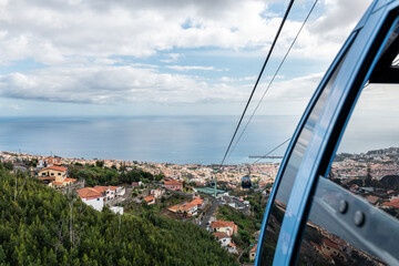 Fototapeta na wymiar Funicular above Funchal, view from cable car at city and harbor