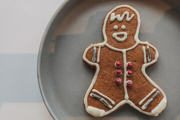 Close up of Gingerbread man cookies served in grey dish.