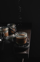 selective focus dark colours home made vegan salt caramel on the table