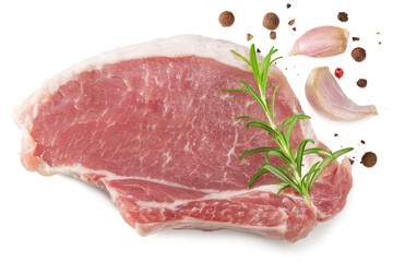 sliced raw pork meat with rosemar, garlic and peppercorn isolated on white background. Clipping path and full depth of field. Top view