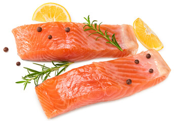 Red fish. Raw salmon fillet with rosemary, peppercorns and lemon isolate on white background. Clipping path and full depth of field. Top view