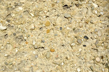 Gravel path in the park. Fine pebbles. An alley in the garden. An interesting pattern for wallpaper, background.