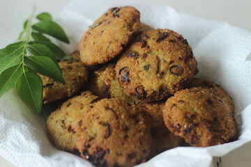 Kodo millet fritters. A crispy fritters made with cooked and mashed kodo millet flour and spices. Disk shaped deep fried evening snack. Commonly known as Kodo millet vada
