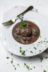 Traditional stew of homemade beef and lamb meatballs in tomato sauce