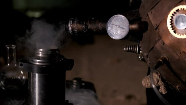 Liquid nitrogen is poured into a thermos from a Dewar vessel. Steam comes out of the thermos. Alchemy, magic