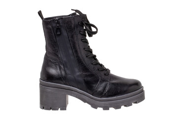 Womens boots and shoes. Closeup of a single elegant black leather winter boots. Latest trends of winter shoe fashion for girls isolated on white background. Macro.