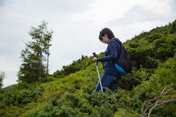 Girl Descend Down a Large Green Mountain Range