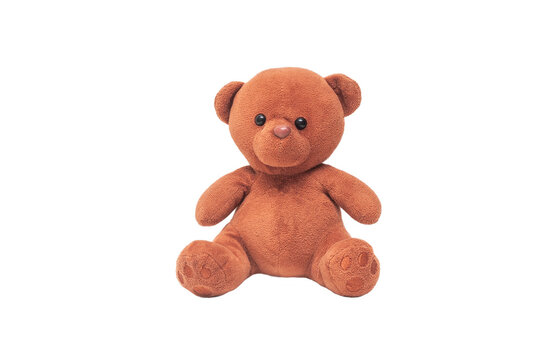 A teddy bear toy sits on a white background. Isolated children's toy on a white background.