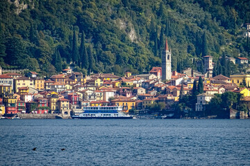 Citty of Varenna, lake como, italy, view from lake with ferry in foreground crossing