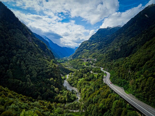 View on beautiful valley of San Bernardino road in Switzerland, blue and cloudy sky