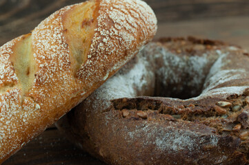 fresh country bread on a wooden background in