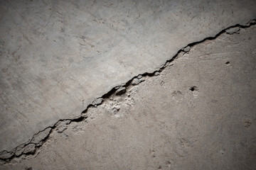 A concrete wall with dust of dirty gray color