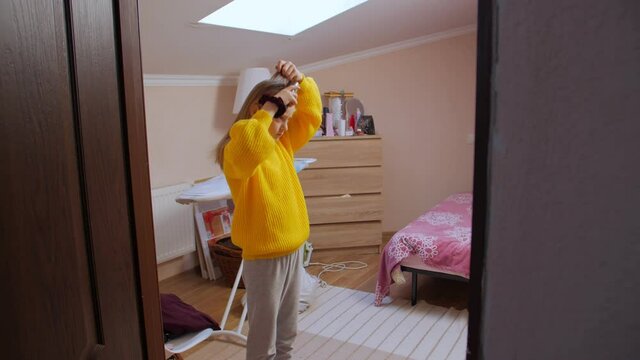 Girl doing her hair camera movement