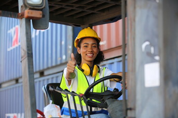 Female truck driver and Foreman control loading Containers box from Cargo freight ship for import...