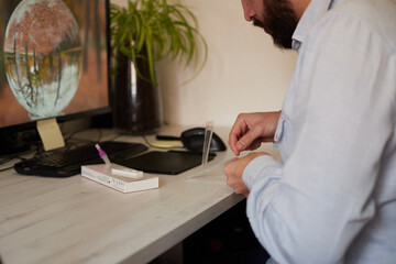Anonymous man preparing for a rapid covid test