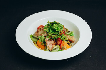The new kind of salad is made by the chef.