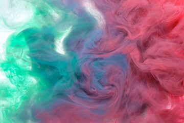 red and green acrylic ink crashing into the water