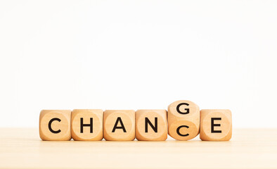 Change to chance concept. Flipping wooden cube block with words. Copy space