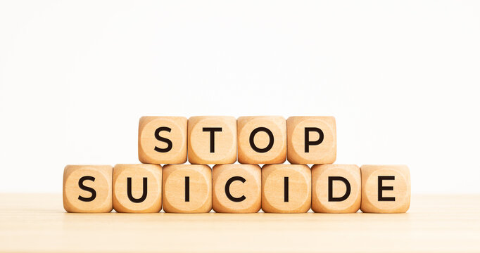 Stop suicide concept. Wooden cube block with words. Copy space
