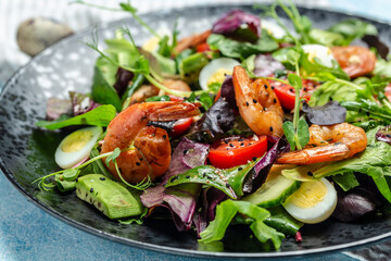 Dietary menu. Healthy salad with cherry tomatoes, cucumber, avocado, eggs and smoked shrimps. Paleo diet menu. banner, menu, recipe, place for text. Top view