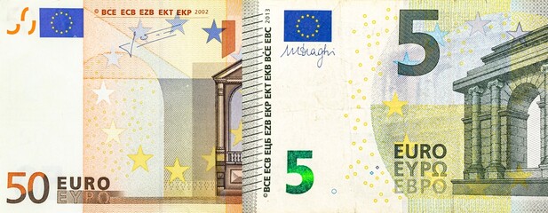 Euro banknotes five and fifty denomination. Macro view of paper money