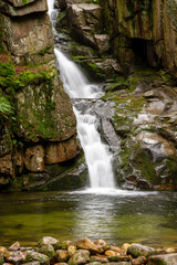 Mountain stream with stones with clear water