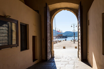 View through an open gate to the harbor of the islandCapital Portoferraio on the island of Elba in...