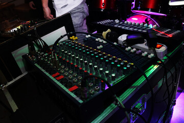 DJ console at the nightclub. Nightlife. Musicians performing in a nightclub