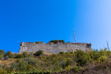 Fototapeta na wymiar City walls and fortifications in the island capital Portoferraio on the island of Elba in Italy under a bright blue sky in summer
