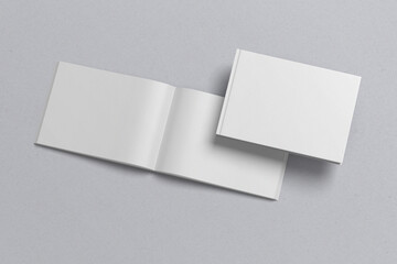 The landscape template of an open book, with flipped pages, with realistic shadows, for presentation of design.