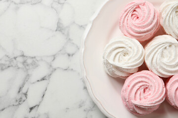 Delicious marshmallows on white marble table, top view. Space for text