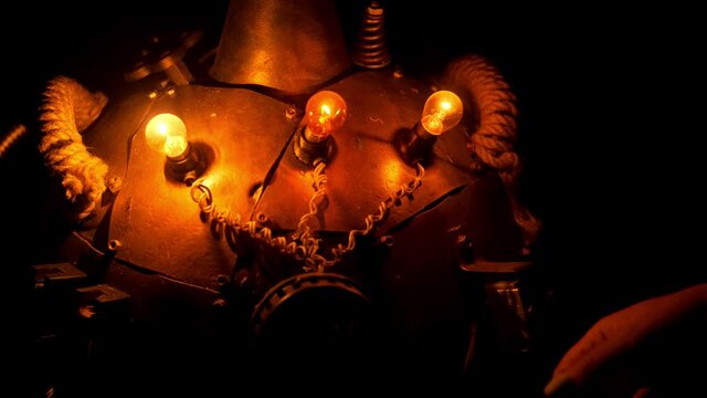 Steampunk. A woman's hand turns on the light bulbs on the dewar Vessel close-up