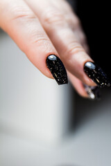hand with black caviar