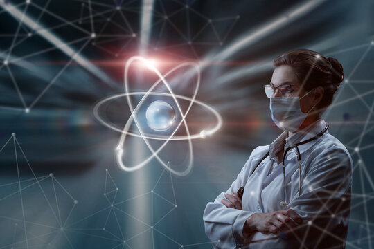 A woman in a mask in uniform looks at an atom on a blurred background.