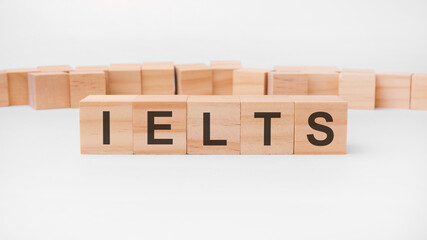 IELTS word, text, written on wooden cubes, building blocks, over white background