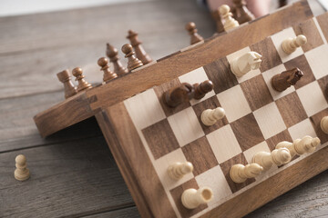 The chessboard is magnetic. Magnetic chess pieces are arranged on a high quality board, demonstrating the power of magnet in the pieces
