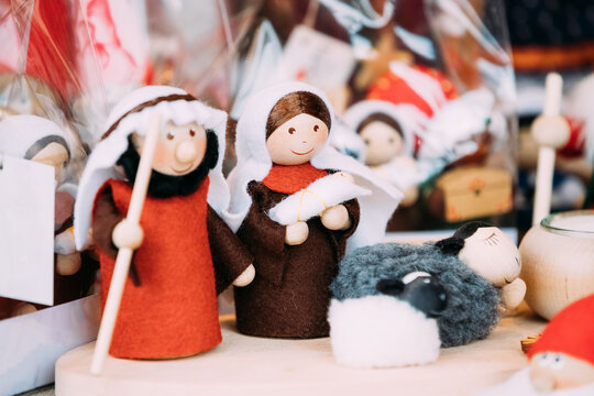 Wooden Dolls Birth of Jesus At Christmas European Market. Popular Christmas Souvenir