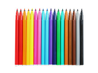 Many colorful markers on white background, top view. School stationery