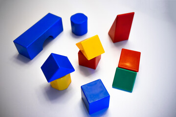 Multi-colored magnetic cubes for children on white isolate. Children's plastic construction kit.