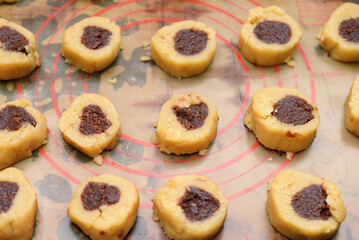 butter dough cookies on baking mat