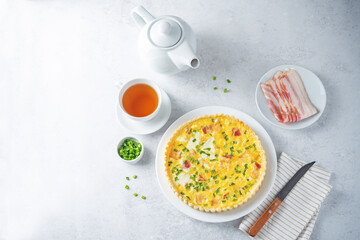 Chicken bacon quiche with scallions in a plate